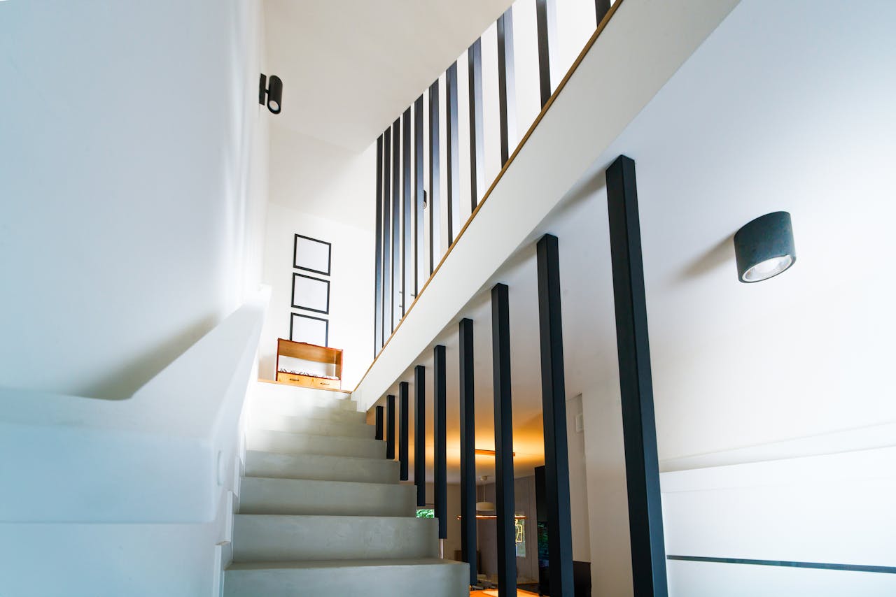 services-01 Brightly lit modern interior staircase with clean lines and minimalist decor.