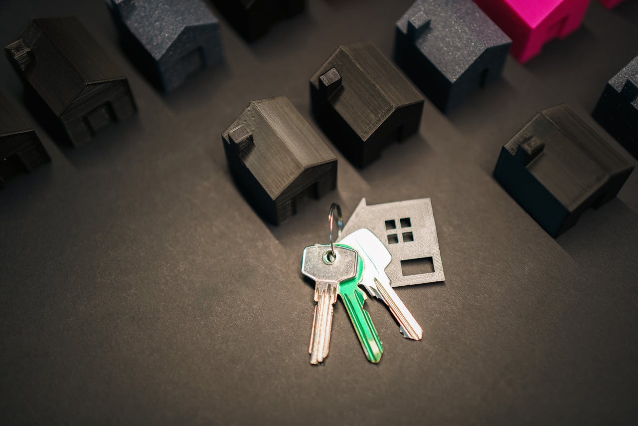 gallery-2 Miniature house models and keys symbolize real estate investment and housing market.